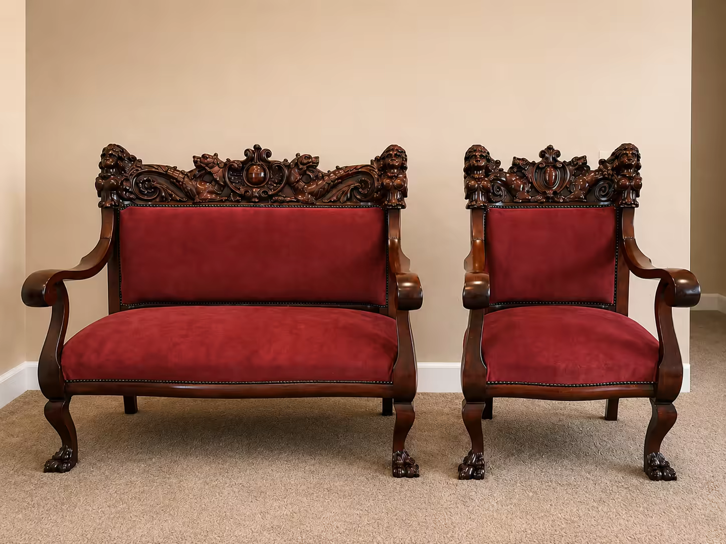 An antique carved lion-head settee reupholstered in red velvet at Master&rsquo;s Touch Upholstery, Santa Rosa, CA