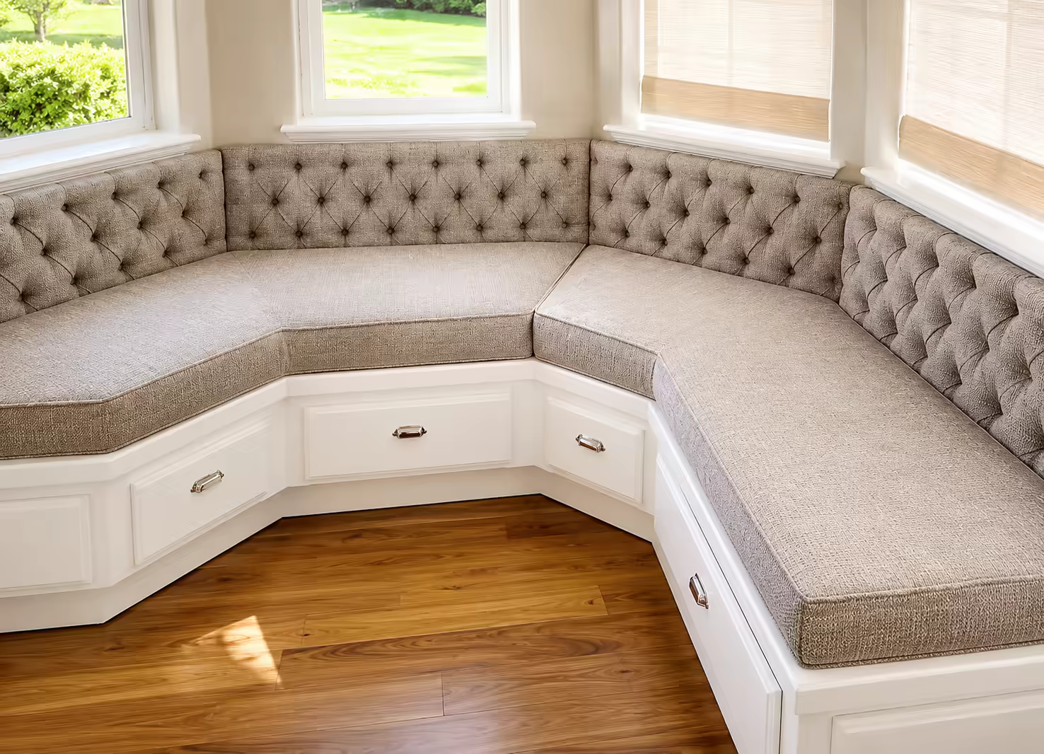 A custom tufted bay-window banquette upholstered in linen by Master&rsquo;s Touch Upholstery, Santa Rosa, CA